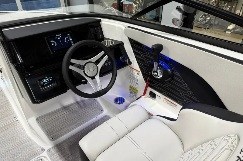 Slide: The Image of 2026 Sea Ray SPX 210 boat cockpit with modern steering and control panel. - 36