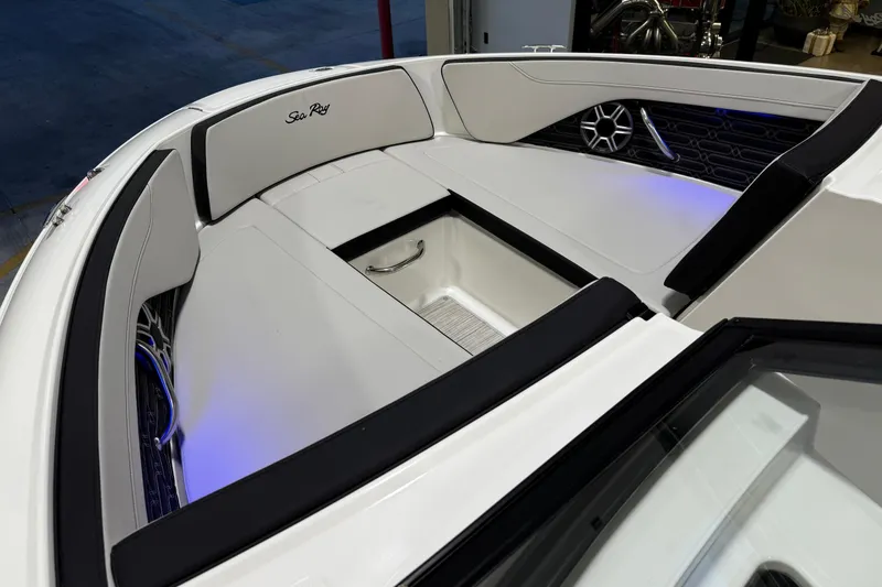 Slide: The Image of 2026 Sea Ray SPX 210 boat interior with sleek seating and ambient lighting. - 38