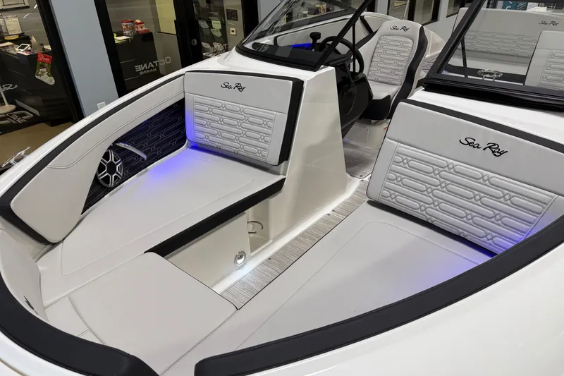 Slide: The Image of 2026 Sea Ray SPX 210 boat interior with stylish seating and ambient lighting. - 6