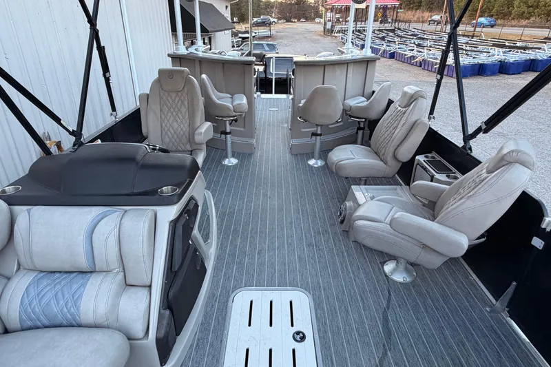 Slide: The Image of Luxurious interior of 2021 Premier 310 Accolade pontoon boat with plush seating. - 12