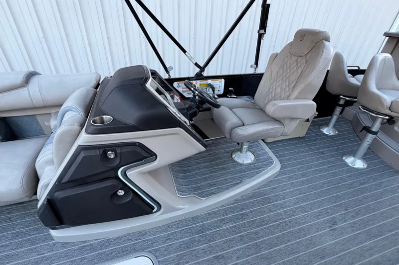 Slide: The Image of 2021 Premier 310 Accolade boat interior with steering console and seating. - 14