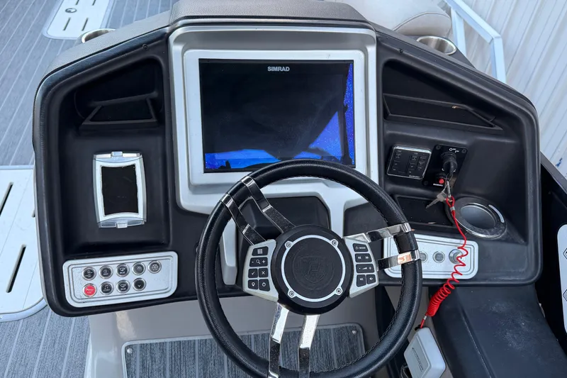 Slide: The Image of Dashboard of 2021 Premier 310 Accolade boat with steering wheel and control panel. - 15