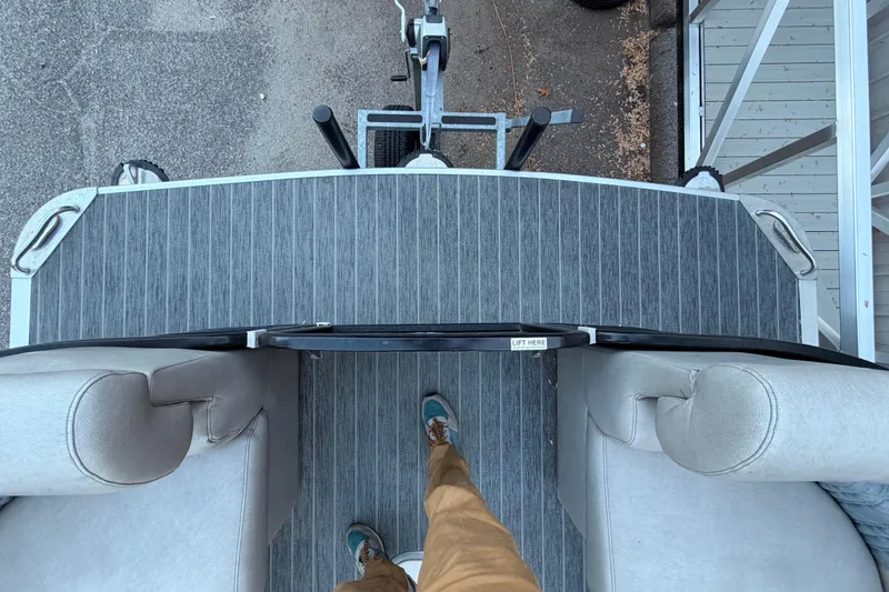 Slide: The Image of Overhead view of 2021 Premier 310 Accolade boat deck with striped flooring and seating. - 19