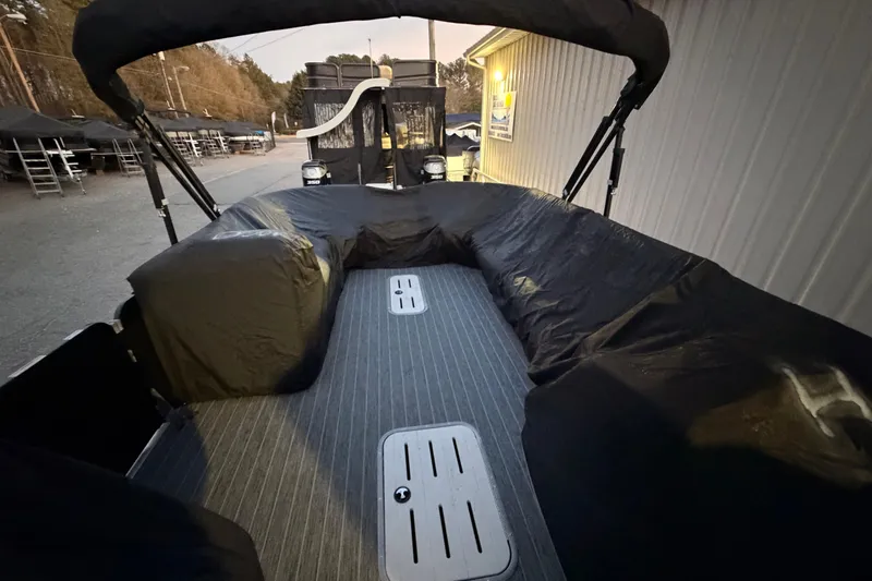Slide: The Image of 2021 Premier 310 Accolade boat interior with covered seating and flooring. - 26