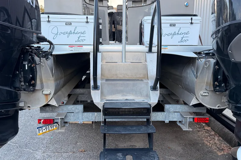 Slide: The Image of Premier 310 Accolade 2021 boat with dual engines and rear entry steps. - 5