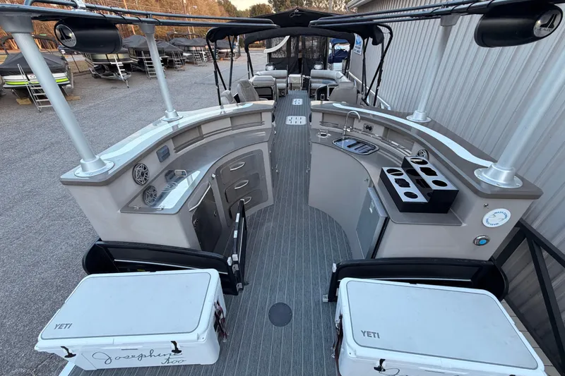 Slide: The Image of 2021 Premier 310 Accolade boat interior with bar setup and Yeti coolers. - 6