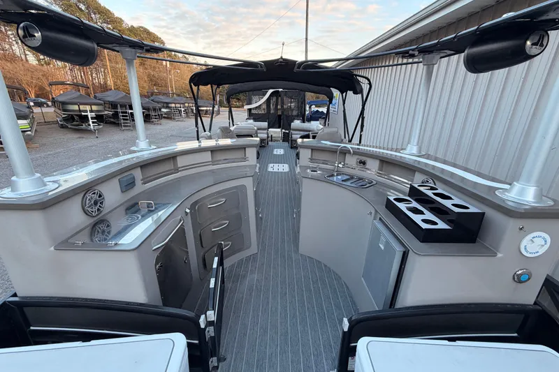Slide: The Image of 2021 Premier 310 Accolade boat interior with modern amenities and sleek design. - 7