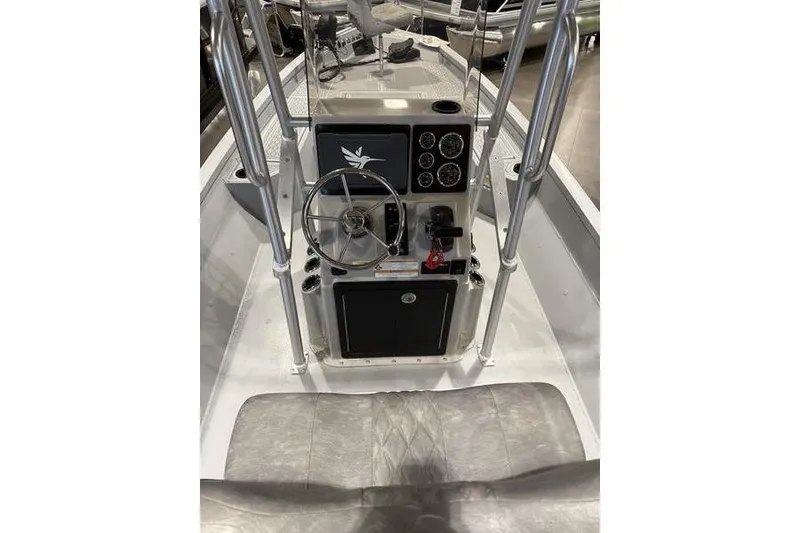 Slide: The Image of 2026 G3 Bay 22 GX boat console with steering wheel and gauges. - 2