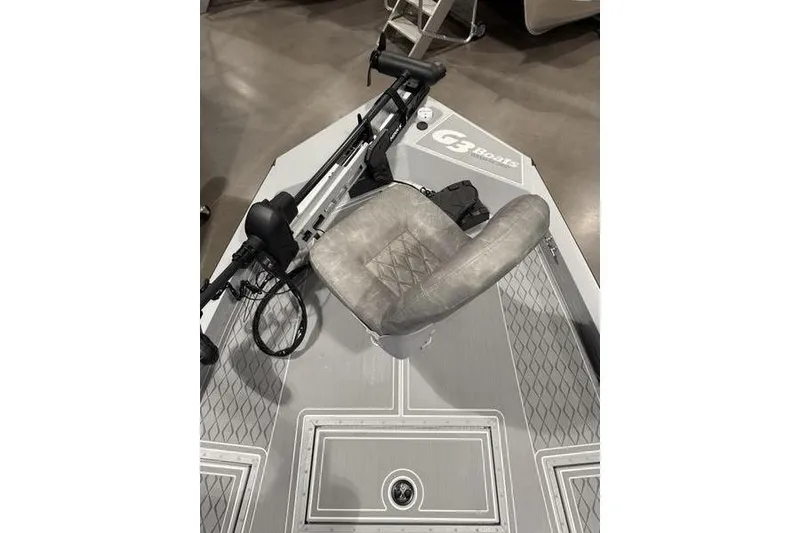 Slide: The Image of 2026 G3 Bay 22 GX boat deck with seat and trolling motor. - 4