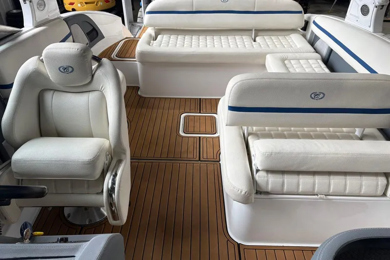 Slide: The Image of 2018 Cobalt R5 Surf boat interior with white leather seating and teak flooring. - 11
