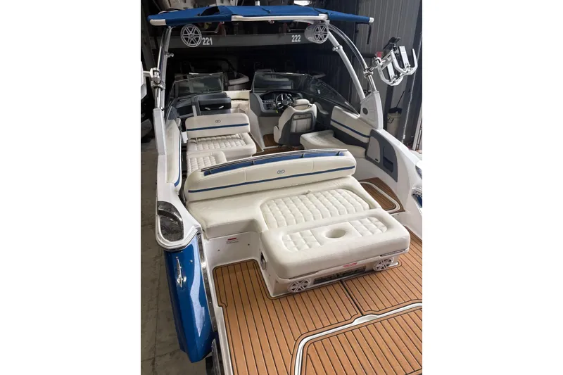 Slide: The Image of 2018 Cobalt R5 Surf boat interior with luxurious seating and teak flooring. - 17