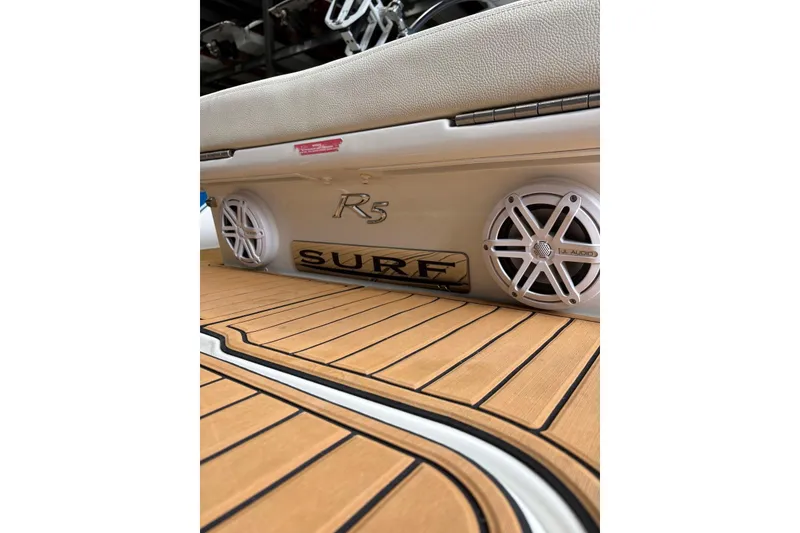 Slide: The Image of 2018 Cobalt R5 Surf boat interior with JL Audio speakers and teak flooring. - 22