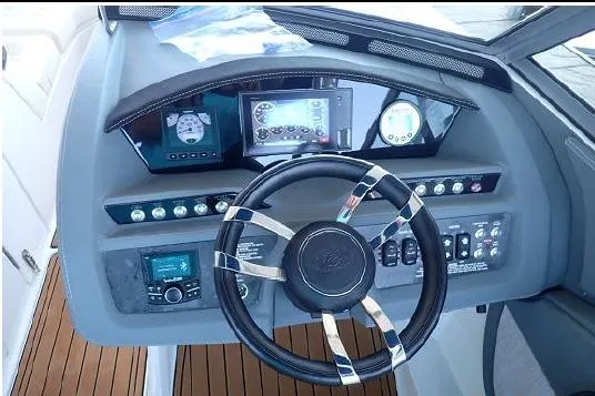 Slide: The Image of 2018 Cobalt R5 Surf boat dashboard with modern controls and steering wheel. - 23