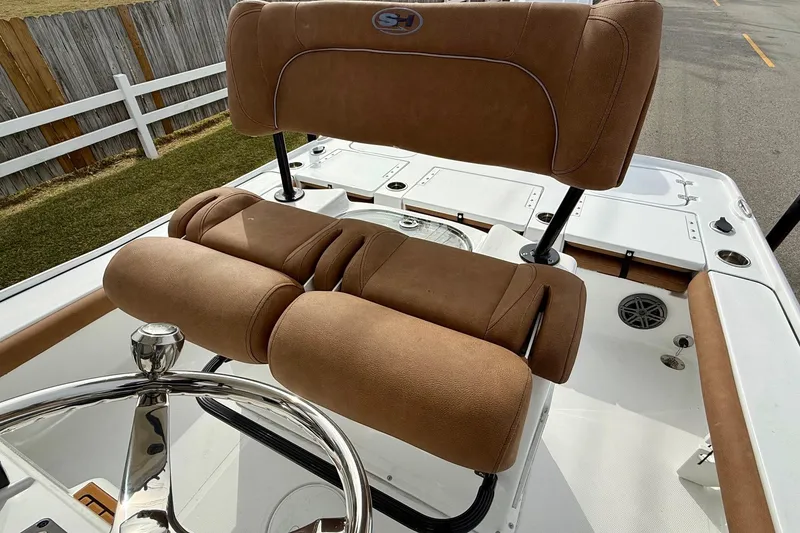 Slide: The Image of 2026 Sea Hunt BX 22 BR boat with brown upholstery and helm station. - 10