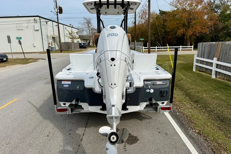 Slide: The Image of Rear view of a 2026 Sea Hunt BX 22 BR boat on the street. - 3