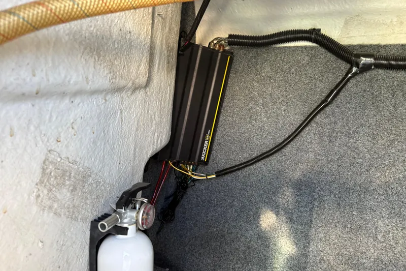 Slide: The Image of Fire extinguisher and amplifier in 2015 Yamaha Boats 212X interior. - 10