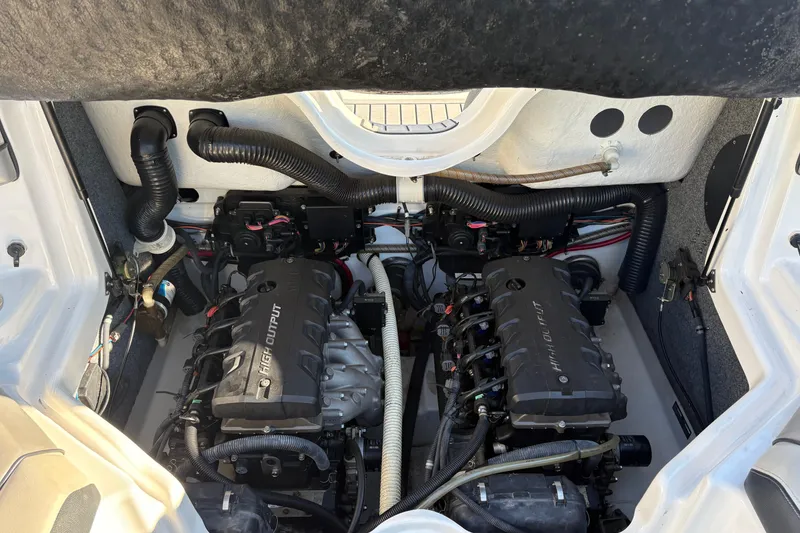 Slide: The Image of Engine compartment of a 2015 Yamaha Boats 212X, featuring dual high-output engines. - 16