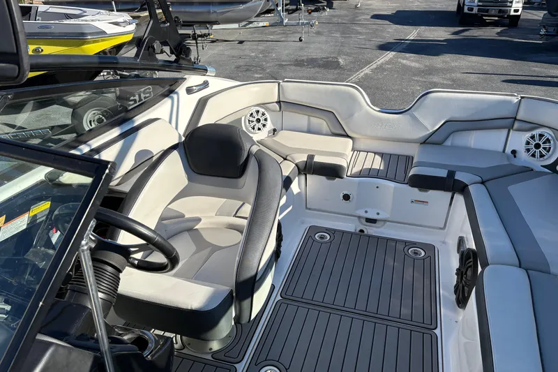 Slide: The Image of 2015 Yamaha Boats 212X interior with seating and steering wheel, showcasing modern design. - 18