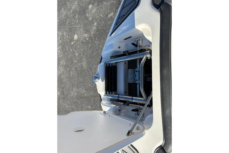 Slide: The Image of 2015 Yamaha Boats 212X engine compartment with open hatch, showcasing internal components. - 24