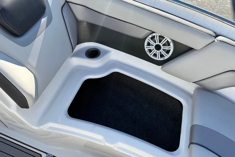 Slide: The Image of Interior of 2015 Yamaha Boats 212X, featuring seating, speaker, and storage compartment. - 25