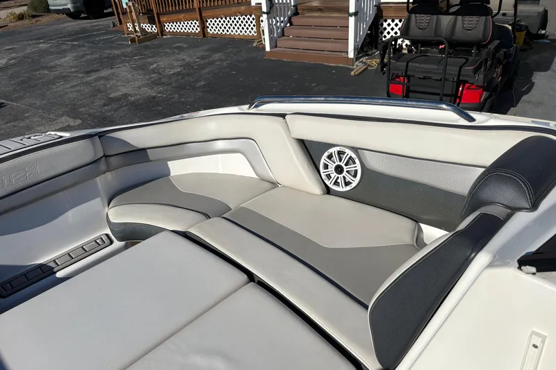 Slide: The Image of 2015 Yamaha Boats 212X interior with cushioned seating and speaker system. - 27