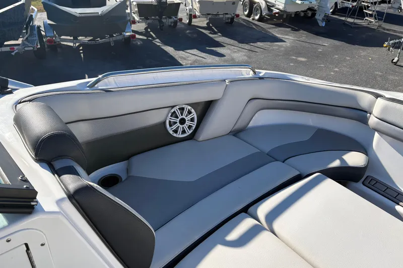 Slide: The Image of Interior of 2015 Yamaha Boats 212X, featuring sleek seating and integrated speaker. - 28