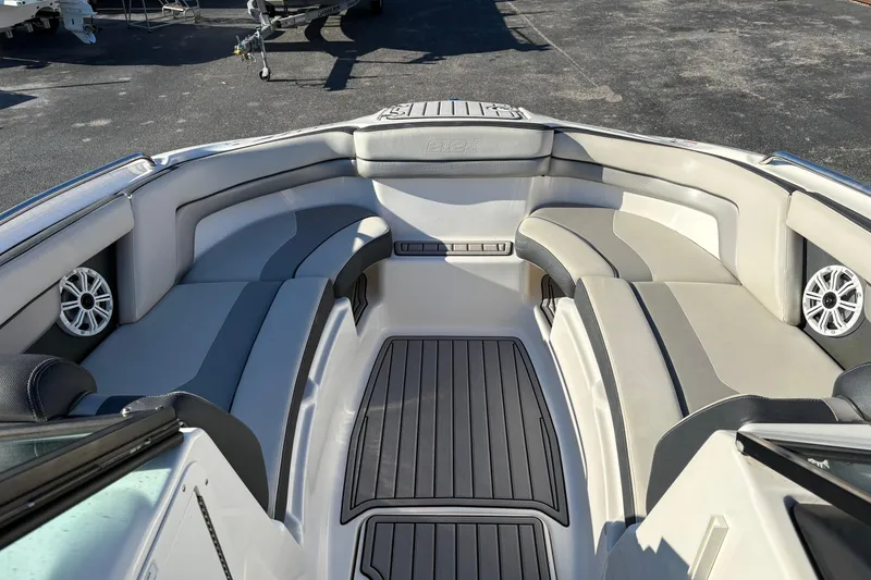 Slide: The Image of 2015 Yamaha Boats 212X interior with spacious seating and sleek design. - 7