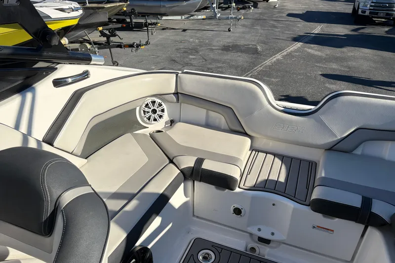 Slide: The Image of Interior seating of a 2015 Yamaha Boats 212X, featuring sleek design and comfortable upholstery. - 9