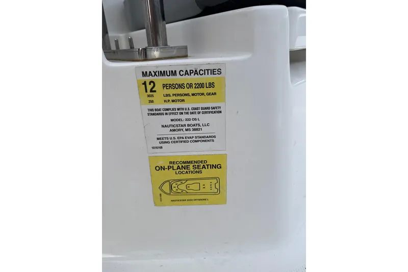 Slide: The Image of 2024 NauticStar 222L Offshore capacity label, maximum 12 persons or 2200 lbs, safety compliance. - 8