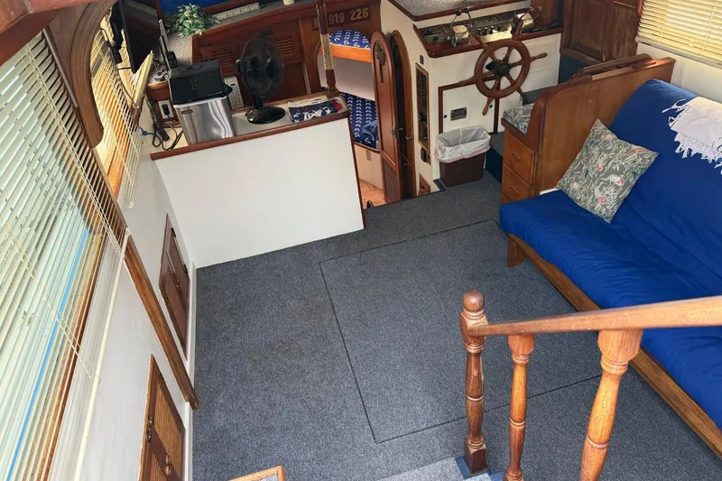 Slide: The Image of Interior of 1984 Golden Star 38 Trawler with cozy seating and nautical decor. - 26