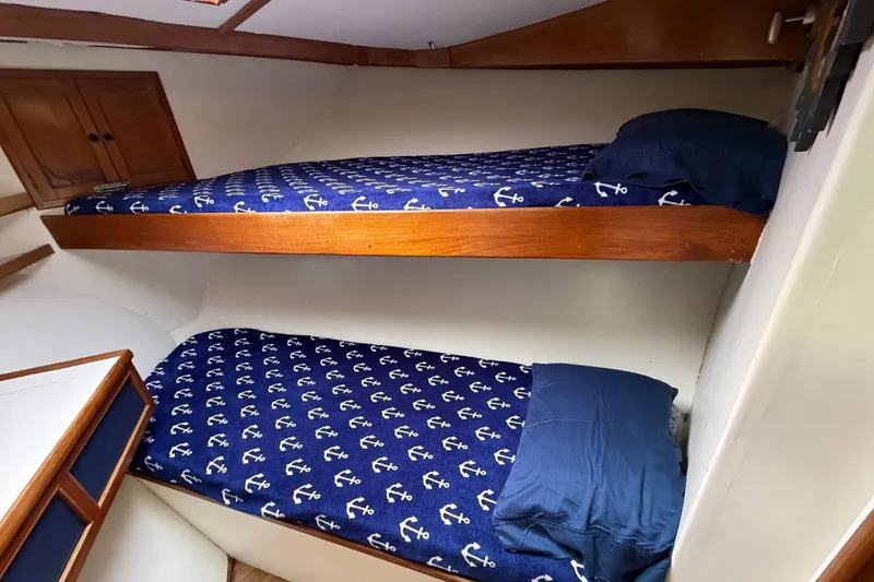 Slide: The Image of Bunk beds with anchor-themed bedding in 1984 Golden Star 38 Trawler cabin. - 35