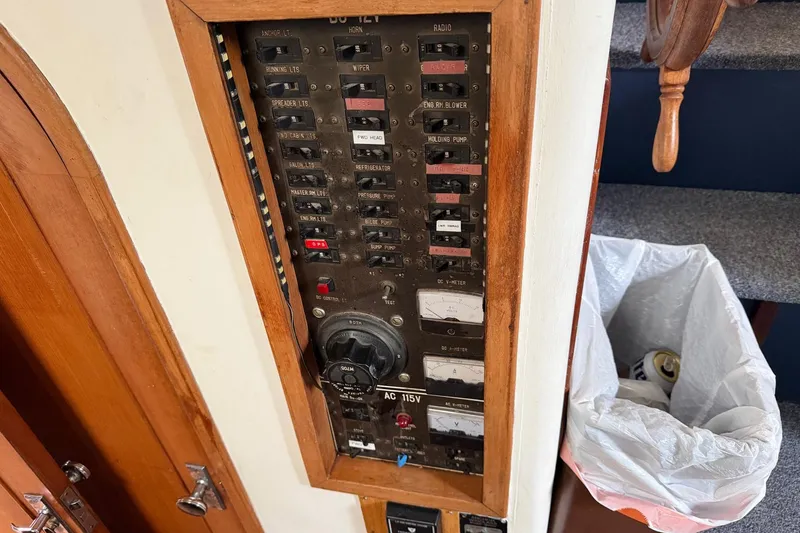 Slide: The Image of Electrical panel on a 1984 Golden Star 38 Trawler, featuring various switches and controls. - 42