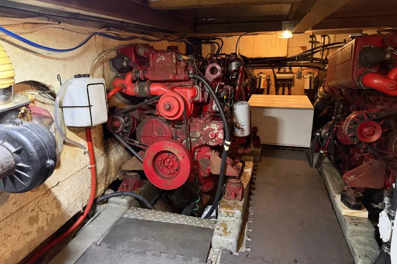 Slide: The Image of Engine room of 1984 Golden Star 38 Trawler with red machinery and piping. - 47