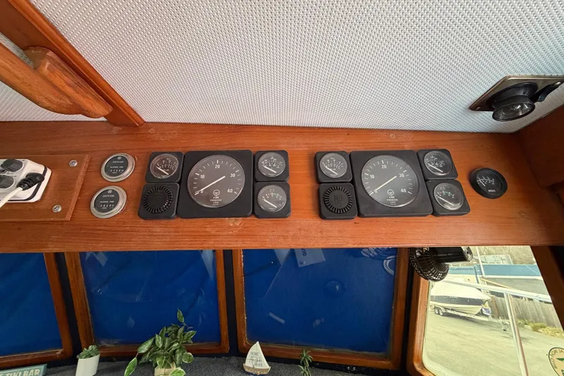 Slide: The Image of Control panel of a 1984 Golden Star 38 Trawler with various gauges and dials. - 51