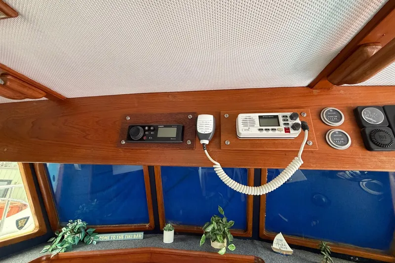 Slide: The Image of Interior of 1984 Golden Star 38 Trawler with radio equipment and decorative plants. - 52