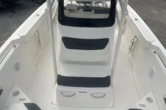 Slide: The Image of 2023 Bayliner Trophy T22CC boat interior with seating and console. - 10