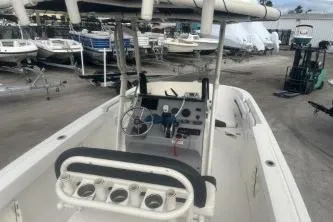 Slide: The Image of 2023 Bayliner Trophy T22CC boat with center console in a marina setting. - 7