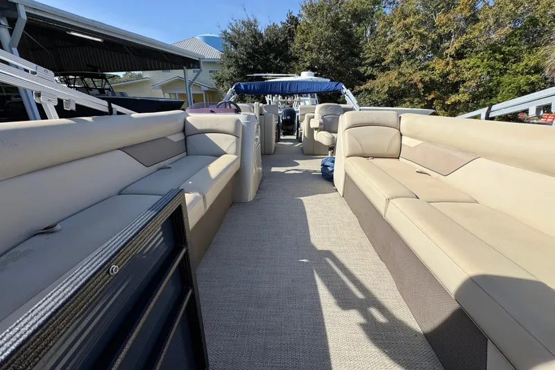Slide: The Image of 2022 Crest Classic LX 240 SLRC pontoon boat with spacious seating and modern design. - 20