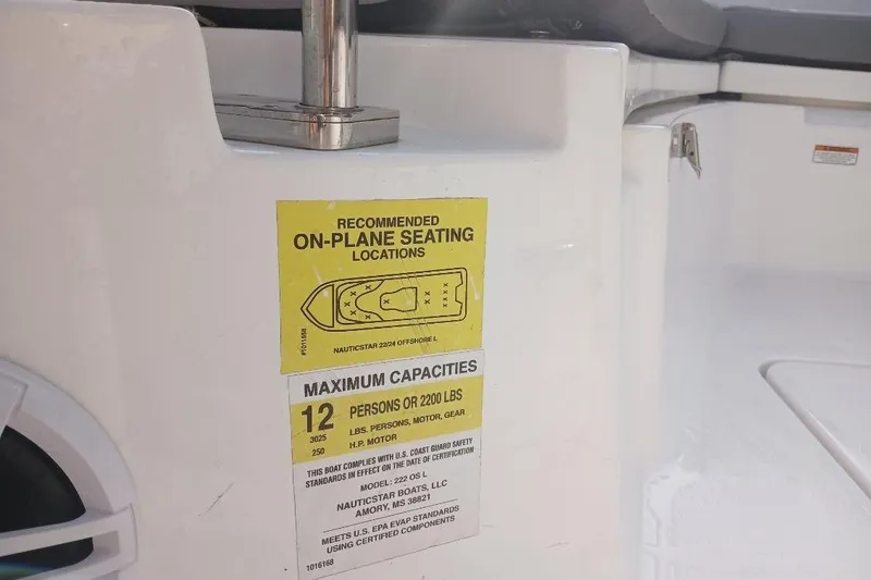 Slide: The Image of 2024 NauticStar 222L Offshore boat seating capacity label, showing maximum of 12 persons or 2200 lbs. - 10