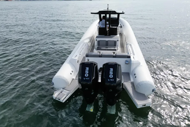 Slide: The Image of 2026 Northstar ORION 10 boat with dual Mercury 350 V10 engines on open water. - 13