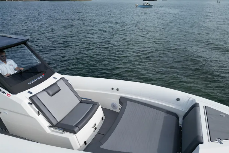 Slide: The Image of 2026 Northstar ORION 10 boat on water, featuring sleek design and comfortable seating. - 8