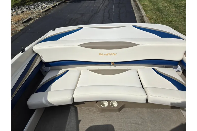Slide: The Image of 2001 Glastron GX 205 boat interior with white and blue seating. - 19