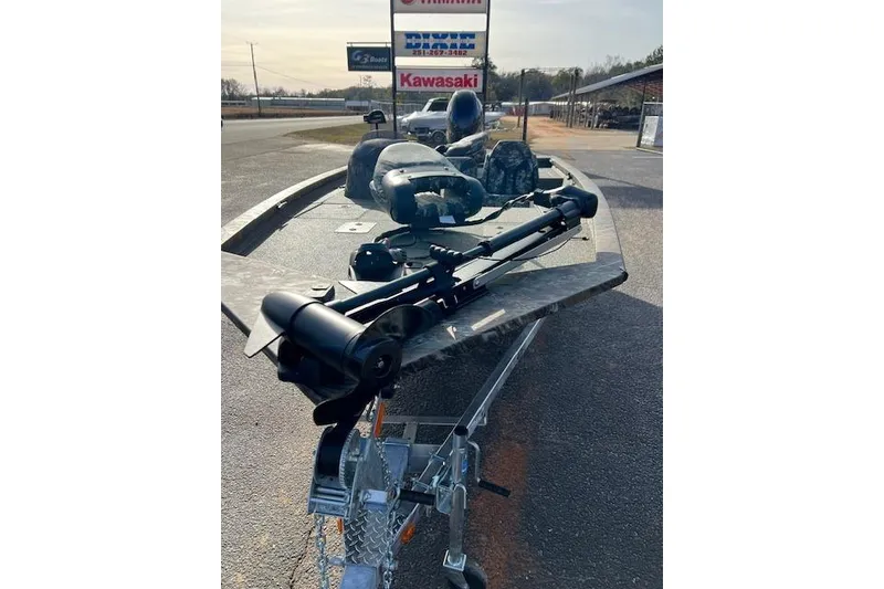 Slide: The Image of 2026 G3 Sportsman 1710 PFX Camo boat on trailer, outdoor dealership display. - 3