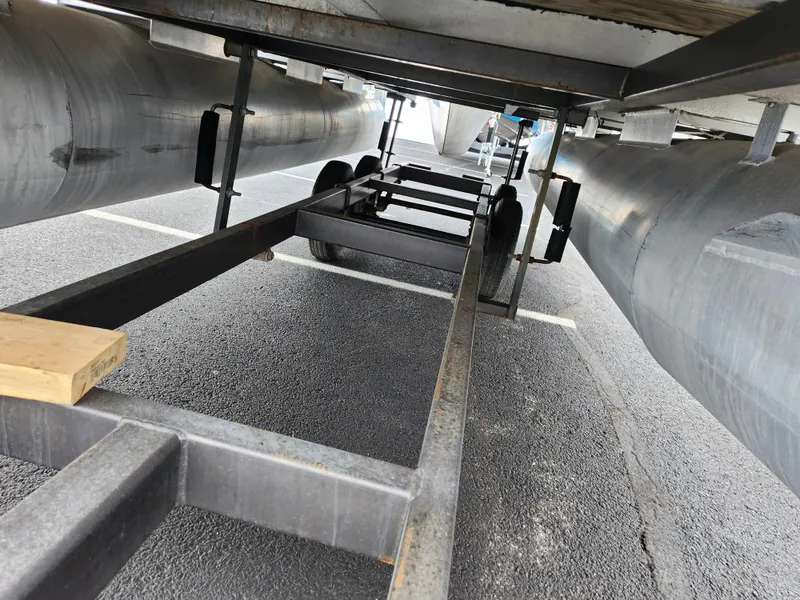 Slide: The Image of Underneath view of a 2000 Sweetwater 180 pontoon boat on a trailer. - 7