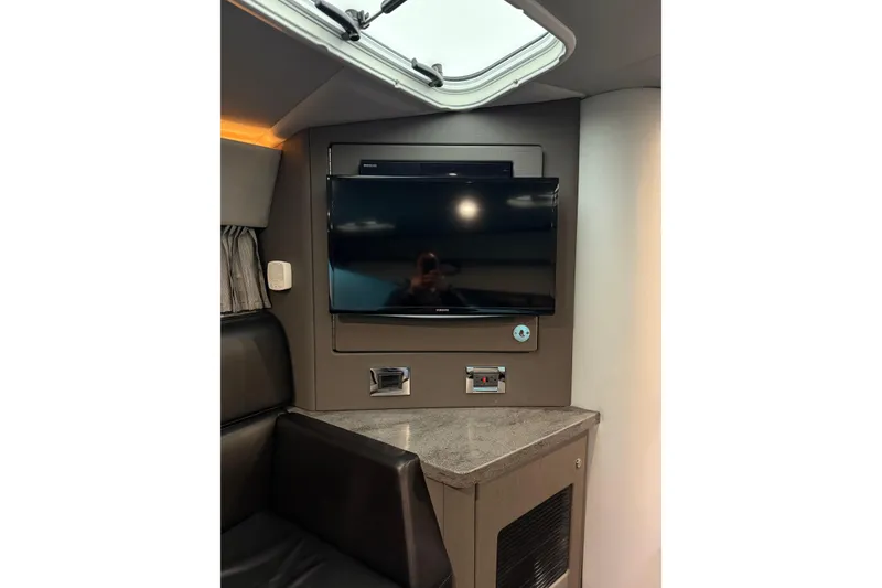 Slide: The Image of Interior of 2018 Formula 400 Super Sport with mounted TV and seating area. - 13