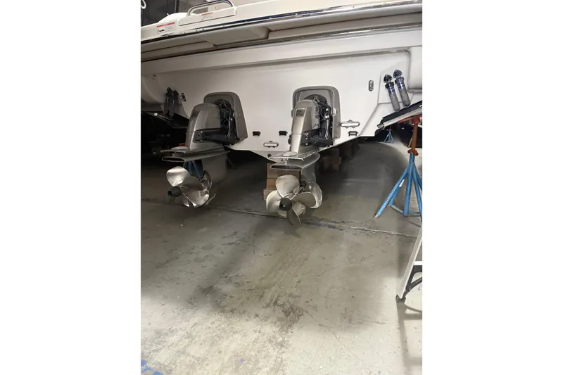 Slide: The Image of 2018 Formula 400 Super Sport boat with dual propellers in a garage setting. - 16