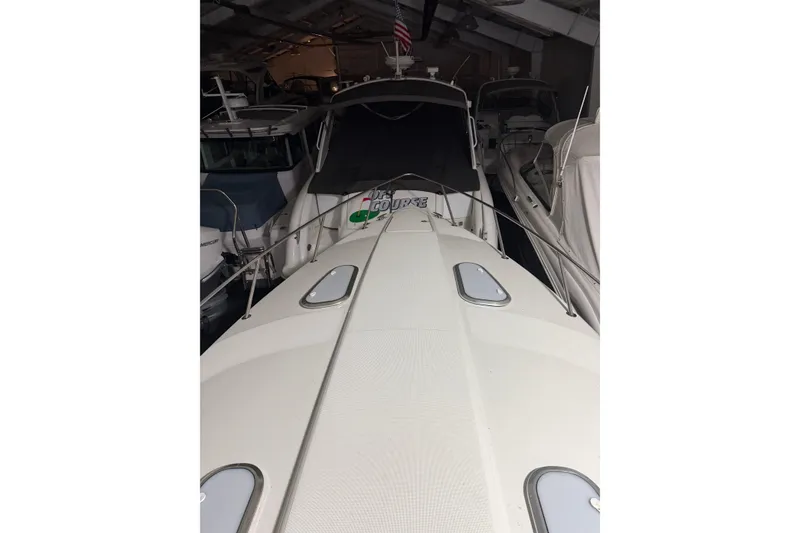 Slide: The Image of 2018 Formula 400 Super Sport boat docked in a marina, surrounded by other vessels. - 21