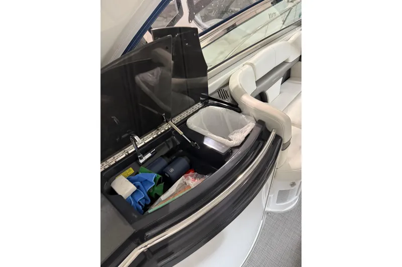 Slide: The Image of Interior of 2018 Formula 400 Super Sport boat with open storage compartment. - 27