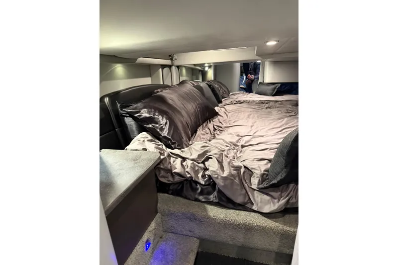 Slide: The Image of Luxurious cabin interior of 2018 Formula 400 Super Sport with plush bedding and ambient lighting. - 4