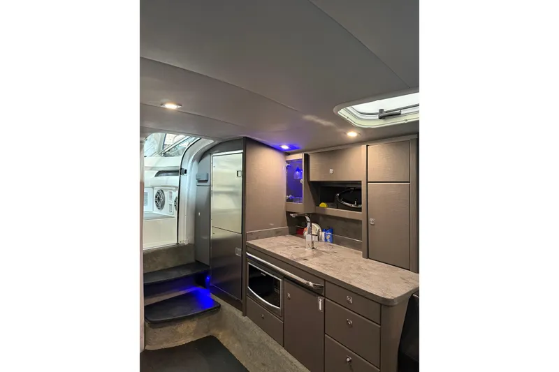 Slide: The Image of 2018 Formula 400 Super Sport yacht interior with modern kitchen and sleek cabinetry. - 6